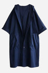 The looselyboho Navy Blue One Size Fits All Oversized Waterproof Windbreaker Jacket features a hood and short sleeves. This stylish raincoat includes large front pockets and a single button closure, providing both comfort and fashion with its loose, oversized fit. It is showcased against a plain white background.